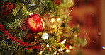 Christmas tree, decoration and holiday with blurred background in home for celebration in December. Background, event and winter with festive ornament in apartment for break or season closeup