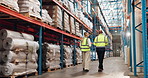 Logistics, team and people in warehouse inspection with checklist for export stock distribution from back. Inventory, planning or workers walking in factory together for project management discussion