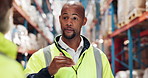 Logistics, leader and man in warehouse with discussion for supply chain planning in export distribution. Inventory, inspection and project manager in factory with teamwork, talk and collaboration