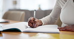 Hands, student and woman with book, writing and education with knowledge in living room. Closeup, person and home with pen, studying and project with proposal, creativity and brainstorming with ideas