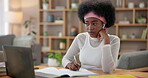 Girl, video conference and communication on laptop with listen, writing and notes for lesson in home. Black woman, tech and talking with e learning for development, education and support as student