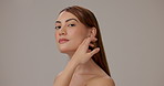 Skincare, beauty and face of woman in studio with natural, glow and hydration treatment. Portrait, cleanse and person from Thailand with dermatology routine for facial elasticity by gray background.