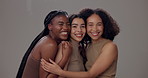 Skincare, diversity and group of women in portrait with beauty, solidarity and skin glow in studio. Cosmetics, support and happy friends with facial shine, confidence and inclusion on grey background