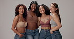 Underwear, diversity and face of women in studio for wellness, beauty and body positivity. Happy, group and portrait of people hug in bra with confidence, self love and inclusion on gray background