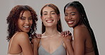 Skincare, face and multiracial women in studio for cosmetics, diversity or results on gray background. Happy, people and dermatology with smile in solidarity for natural beauty, inclusion or equality