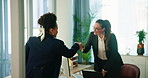 Business woman, lawyer and handshake with colleague for partnership, legal agreement or greeting at office. Female person, attorney or employees shaking hands for labor law or teamwork at workplace