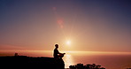 Person, meditation and silhouette on mountain at sunset with mindfulness, lotus and mock up space in sky. Breathing, sunshine and outdoor on cliff with zen balance, yoga and ocean in New Zealand