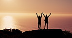 Couple, silhouette and hiking with high five at sunset with ocean, success and mountains on vacation in summer. People, outdoor and mountain with view, sea and cheers with achievement in New Zealand