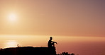 Person, reflection and silhouette on mountain by sunset sky with mindfulness, peace and mockup space in nature. Hiking, sunshine and rest on cliff with balance, memory and ocean in New Zealand