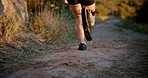 Running, exercise and woman with prosthetic blade for workout, marathon training and fitness. Sports, outdoors and person with disability start for wellness, health and performance on nature trail