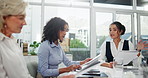 Business woman, meeting and discussion with paperwork for project, agenda or tasks at office. Young female person, people or group of employees discussing documents, schedule or mission at workplace