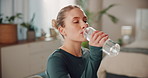 Woman, home and yoga with drinking water for hydration, thirst and health with exercise. Female person, liquid bottle and tired on break with workout for fitness for self care, wellness and detox