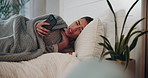 Sick woman, bed and phone call with pills for telehealth, conversation or discussion at home. Young, female person or patient talking on mobile smartphone in bedroom for health advice or symptoms