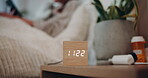 Alarm, night and time with person in bedroom of home for break, rest or sleep on weekend evening. Clock, digital and relax with bedside table in apartment for hospitality, peace or quiet in dark