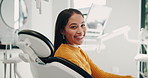 Dentist, healthcare and face of woman with smile for consulting, teeth whitening and wellness. Happy, dentistry and portrait of person in chair for dental hygiene, oral care and medical services