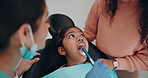 Mouth, kid and dentist with tools for teeth cleaning, oral hygiene or orthodontics. tooth, dental treatment and girl in pediatric clinic with hands of mother with intraoral camera or light for health