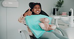 Dentist, happy and face of child with thumbs up and teddy bear for consulting, cavity or wellness. Healthcare, dentistry and portrait of girl in chair for dental hygiene, oral care or medical service