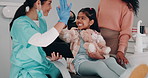 Child, women and dentist with tablet for high five, xray demonstration and results of tooth cleaning procedure Girl, mother and orthodontist with interactive learning, health advice and dental clinic