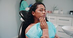 Clinic, woman and pain with toothache for consultation, appointment and checkup for oral care. Hospital, dental cleaning and female person with sore for teeth decay, gum disease and impacted wisdom