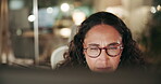 Face, mature woman and reading on computer at night with online research for deadline and overtime at office. Female person, employee and concentrating as administrator for email and schedule