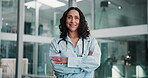 Arms crossed, doctor and smile with woman in hospital for professional healthcare or medical career. Cardiology, portrait and wellness with medicine specialist in clinic for consultation or trust