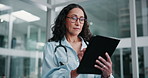 Serious, doctor and woman on tablet for research article, results and information. Technology, app and medical worker on internet for telehealth report, healthcare update and typing email in hospital