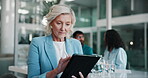 Tablet, mature woman and hospital director with research for medical finance or funding. Office, digital technology and senior clinic administrator for healthcare, scroll and internet for information