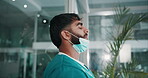 Fail, stress and medical student man in hospital with reaction to crisis, death or loss for internship. Face, mask and window with unhappy nurse in professional clinic for healthcare or medicine