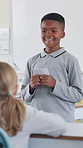 Boy, school and talking for oral presentation, show and tell with learning, development and progress. Kid, education and assessment for public speaking with speech, notes and language in classroom