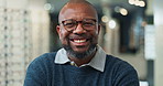 Face, glasses and welcome with optometrist black man in eyewear store for checkup or consultation. Assessment, portrait and smile of mature person in optometry clinic for assessment or vision