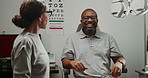 Eye care, man or expert in clinic with glasses, feedback or discussion for advice. Optometrist, happy patient and new lenses in practice for healthcare, vision or impressed with results with wellness