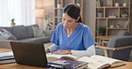 Woman doctor, writing and textbooks in practice for healthcare, schedule and research for diagnosis. Specialist, laptop and documents at table for consultation preparation with medical references