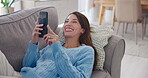 Woman, relax and laughing on sofa with smartphone for funny text message, social media meme or online joke in home. Person, phone and happy in lounge with streaming subscription and fun dating site
