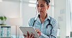 Woman, doctor or medical research with tablet for telehealth or new discovery at hospital. Female person, cardiologist or healthcare employee with technology for online medicare or browsing at clinic