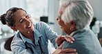 Happy woman, doctor and patient with shoulder checkup for diagnosis, consultation or healthcare exam at clinic. Female person, medical employee or health consultant with senior client for advice