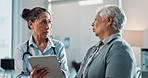 Doctor, senior woman and tablet for consulting in clinic, talking and feedback on test for diagnosis. Physician, elderly person and speaking to nurse in hospital, discuss insurance and healthcare