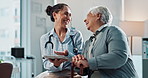 Doctor, old woman and tablet for consulting in clinic, laughing and feedback on test for diagnosis. Physician, person with disability and speaking to nurse, discuss arthritis recovery and healthcare