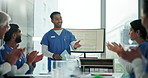 Applause, computer screen and presentation with doctor team in hospital boardroom for coaching. Smile, success and support with medicine professional group clapping for healthcare or medical seminar