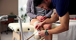 Person with a disability, support and physiotherapy with measuring tape for prosthetic leg in wellness clinic. People, medic and amputee at rehab center for movement, mobility or physical examination