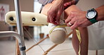 Person with a disability, hands and physiotherapy for prosthetic leg with measuring tape in wellness clinic. People, medic and amputee at rehab center for movement, mobility or physical examination