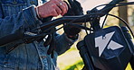 Hands, motorcycle and put on gloves closeup outdoor for safety, protection and travel equipment. Rider, bike and person with gear to prepare for sport, adventure and start journey on transportation