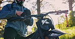 Hands, bike and wear leather gloves for safety, protection and travel equipment closeup outdoor. Rider, motorcycle and person with gear to prepare for sport, adventure and start journey on transport