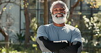 Arms crossed, exercise and mature man with smile, fitness or training in park, sportswear or happy. Outdoor, face and workout for benefits of longevity, healthy or routine for black person in morning