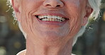 Elderly person, mouth and oral care in nature with smile, new dentures and pride for wellness. Senior woman, teeth and happy outdoor for retirement, healthcare or dental hygiene or veneers in closeup