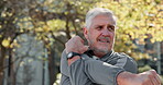 Nature, thinking or old man stretching arms to start running, outdoor workout or training in park. Flexible, retirement and senior runner in fitness routine for muscle warm up, exercise or health