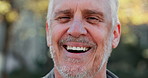 Face, funny and smile of old man outdoor in nature for adventure, fitness or hiking closeup. Exercise, portrait and retirement with happy senior person laughing in forest to explore New Zealand