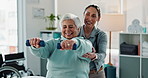 Happy woman, physiotherapist and physical therapy with dumbbells for exercise or therapeutic technique at clinic. Female person, therapist and senior patient weightlifting for muscle recovery session