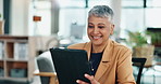 Business woman, tablet and typing in office for email, contact and company web update. Mature assistant, tech and happy in corporate workplace with feedback, research and smile for industry review