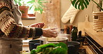 Hands, pot and pasta in house for cooking, flavor and dinner with meal prep, brunch or stove in kitchen. Person, oven and spaghetti in home for food, recipe or lunch with diet, nutrition and steam
