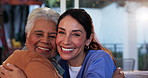 Hugging, face and nurse with senior patient in assisted living facility for good news celebration. Checkup, grateful and happy elderly female person embracing caregiver for medical treatment success.